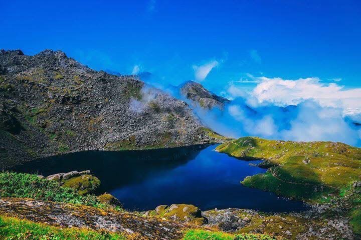 Alpine lake below Himalayan peaks in Nepal